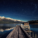 night, lake, pier, reflection, mountains, stars wallpaper
