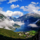geirangerfjord, mountains, more and romsdal, geiranger, norway, fjord, village, clouds wallpaper