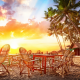 beach, sand, palms, bungalow, chair, table, sunset, tropics wallpaper