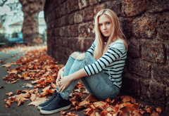 women, sitting, pants, jeans, torn jeans, sneakers, leaf, autumn wallpaper