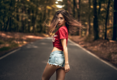 women, t-shirt, jeans shorts, road, hair in face, trees, outdoors, forest wallpaper